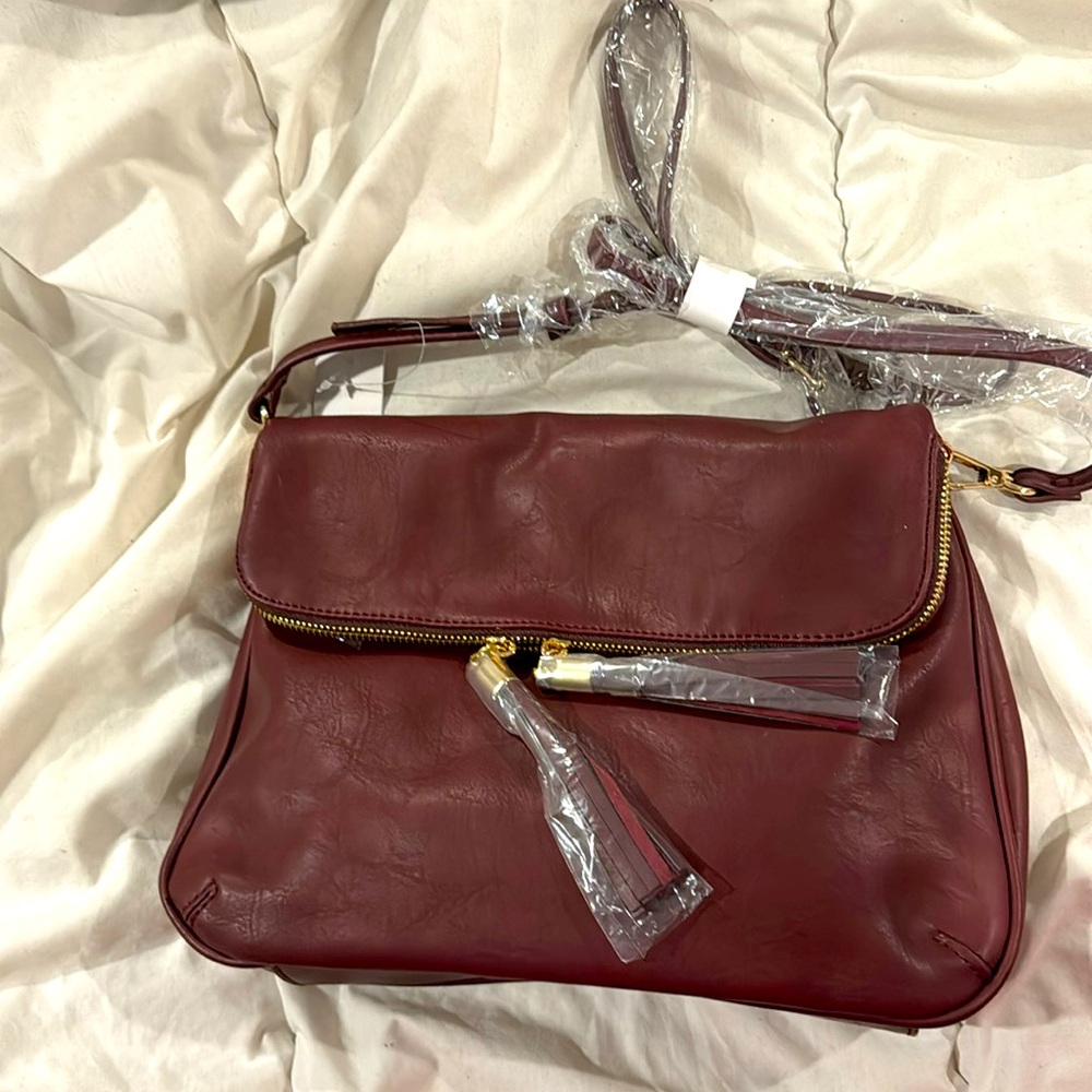 NWT BP. Burgundy faux leather crossbody with zippered pockets foldover bag